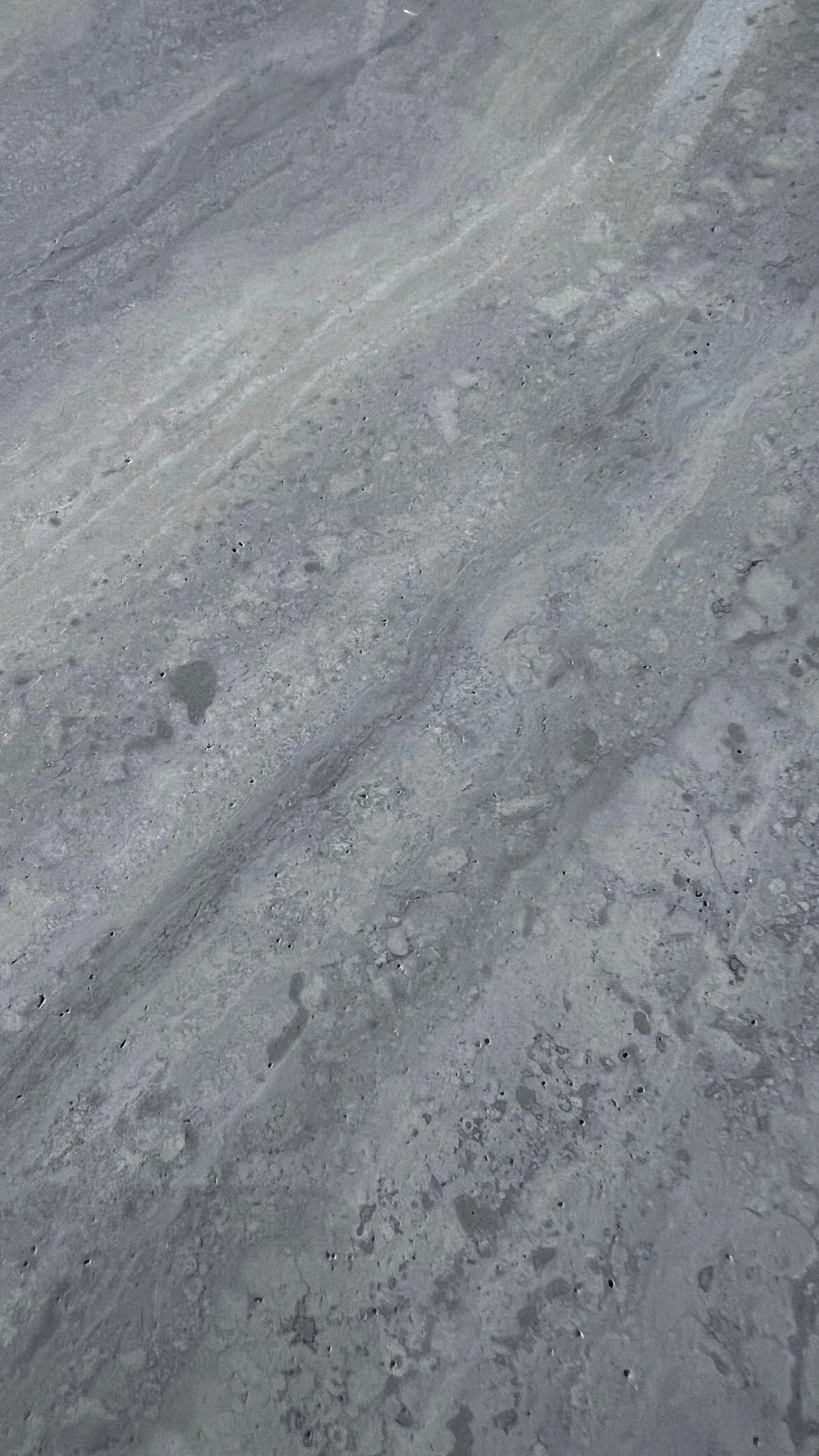 Grau-beiges Natursteinmuster mit feiner Zeichnung